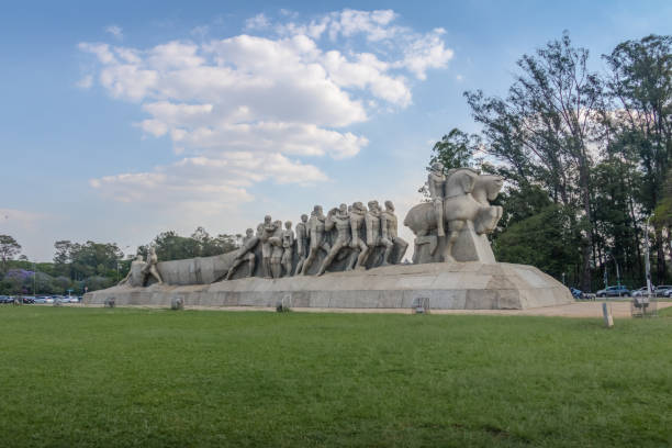 Beijing, China - December 09, 1995: Tourists, both local and international, pose for photographs near the monument outside the Mao Zedong Mausoleum on Tiananmen Square in Beijing, China. The image was originally shot on 35 mm color film, scanned and restored in Adobe Lightroom Classic and Photoshop by the photographer.