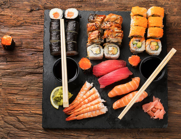 istock Sushi Set nigiri, sushi rolls and sashimi 907961554