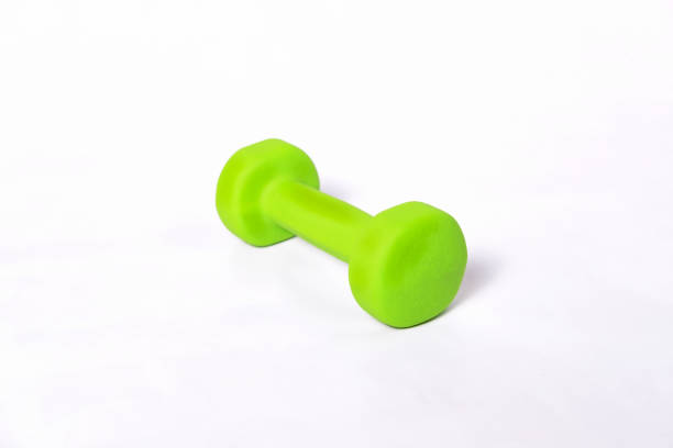 istock green fitness dumbbell covered with soft material 907961688