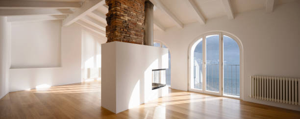 istock Modern living room with fireplace in the middle 907963816