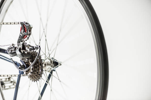 istock bicycle gears and wheel with spokes isolated on white 907964724