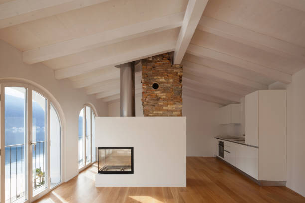 istock Modern living room with fireplace in the middle 907966120