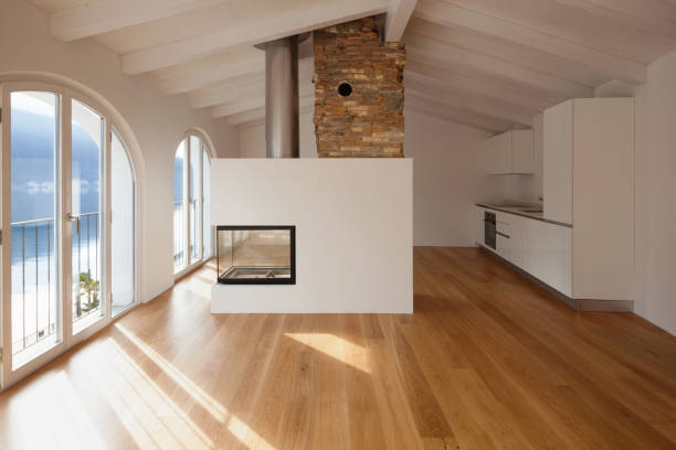 Modern living room with fireplace in the middle stock photo