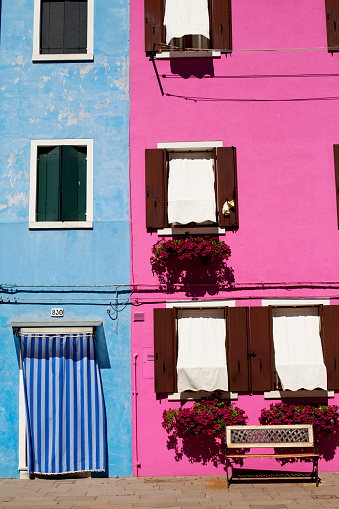 Colourful residential houses in Burano Island - a hot travel destination. Sunny calm day in spring - May, 2013.