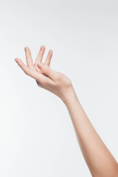 istock female hand with perfect skin isolated on white 907967504