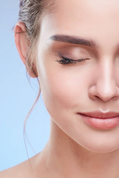 istock Half face of woman with closed eyes 907971276