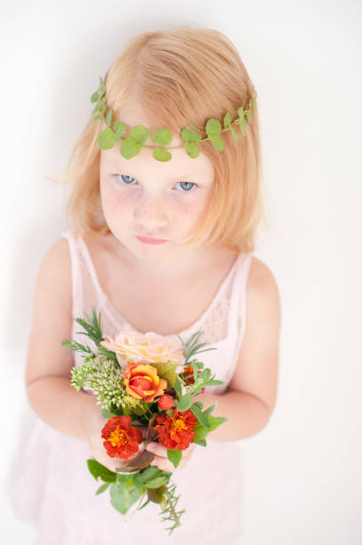 istock Kid with freckles and a diadem 907971862
