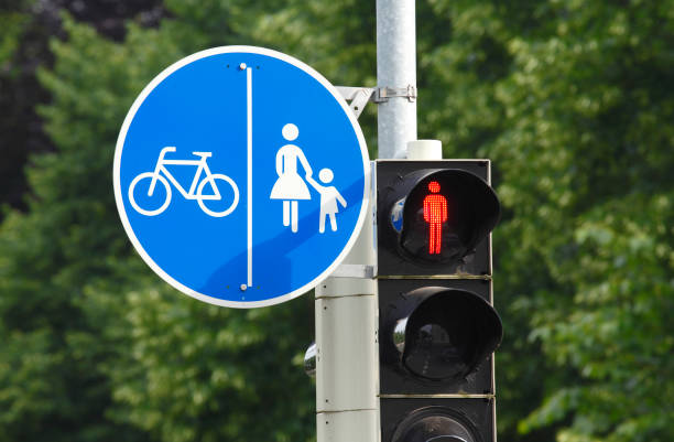 Traffic sign common footpath and cycle path, traffic light switched to red, traffic signs