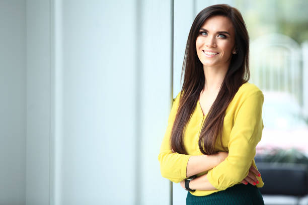 istock Modern business woman in the office with copy space. 907973704