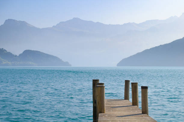 istock Mountain lake and wood deck in Switzerland 907978814