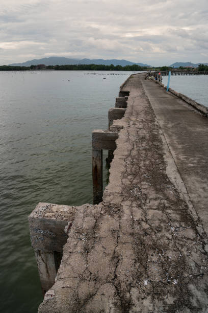 istock Bridge concrete on the sea. 907980938