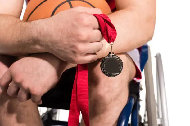 Photo of Sportsman in wheelchair with medal