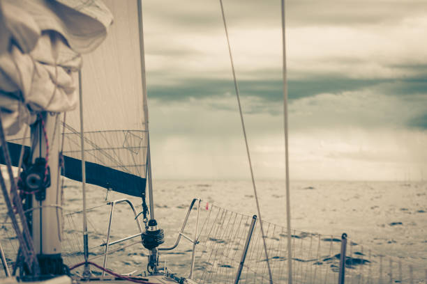 istock Yachting on sail boat during sunny weather 907984034