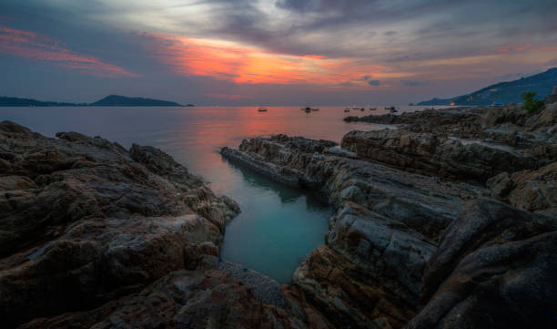 istock An evening sea view with beautiful rock formations. 907985576