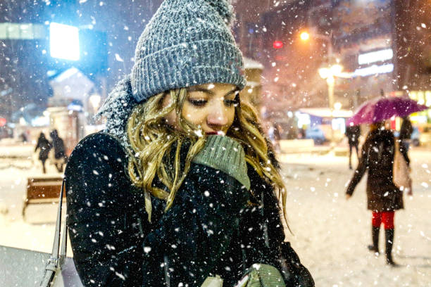 beautiful young woman enjoy on first snow - coat warm clothing one person joy imagens e fotografias de stock
