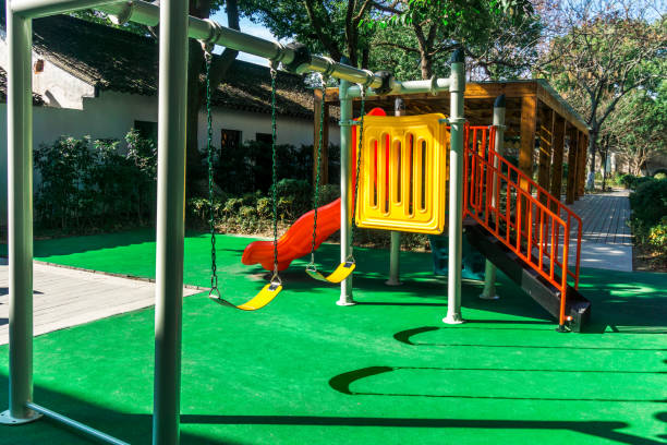 istock Children's swing and slide, shooting in the park 907990258
