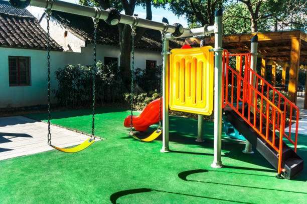 istock Children's swing and slide, shooting in the park 907992310