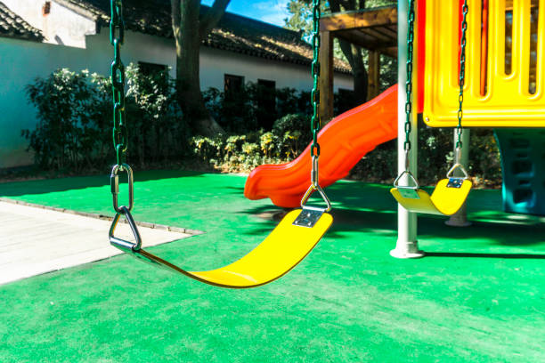 istock Children's swing and slide, shooting in the park 907993044