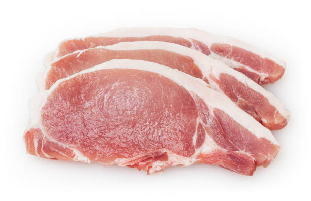 istock Raw pork meat isolated on white background with clipping path 907995786