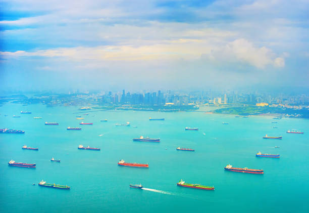 istock Shipping tankers in Singapore harbor 907998856