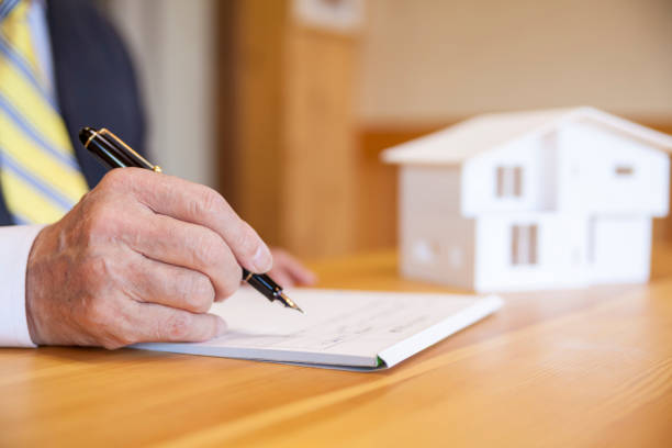 istock Senior Businessman Signing Contract 908000192
