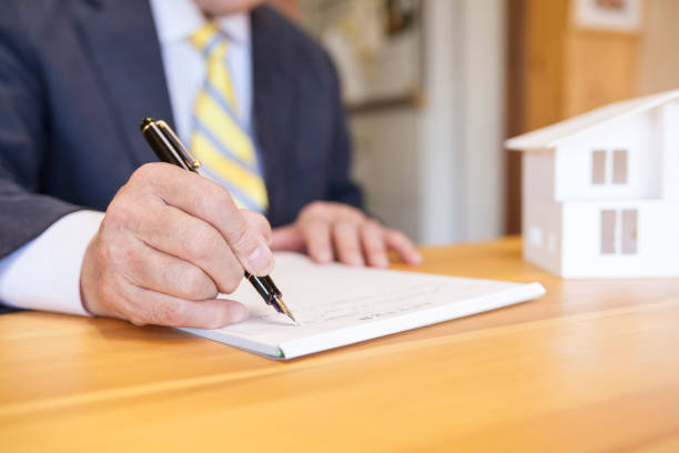istock Senior Businessman Signing Contract 908000232