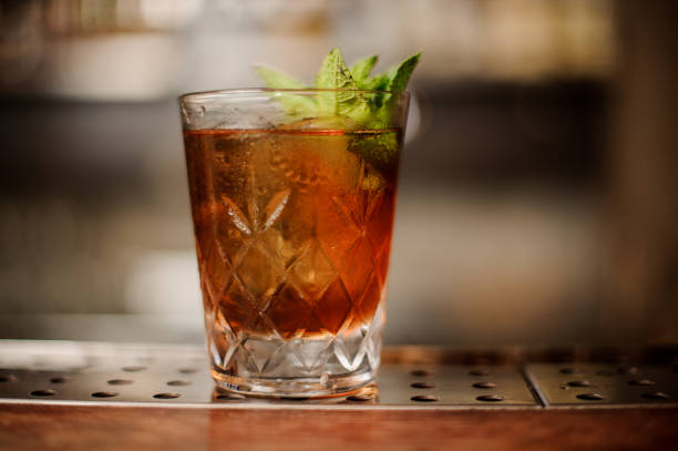 istock Shot glass with alcoholic drink is on the bar 908001246