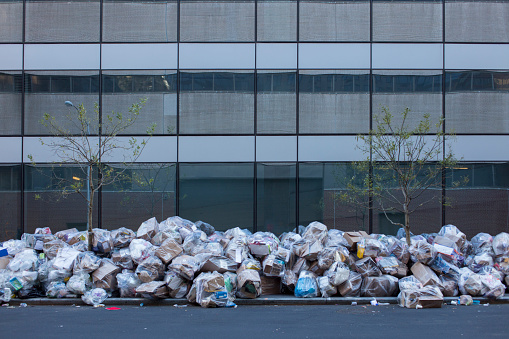 Recycle garbage in front of office building in New York City (paper, carton, box type)