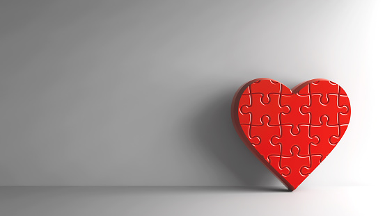 Red Puzzle Heart sign on grey background, three-dimensional rendering, 3D illustration