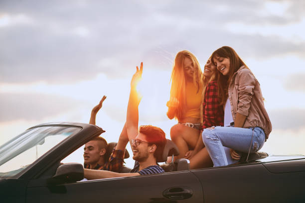 istock Teenagers riding in the car. 908005544