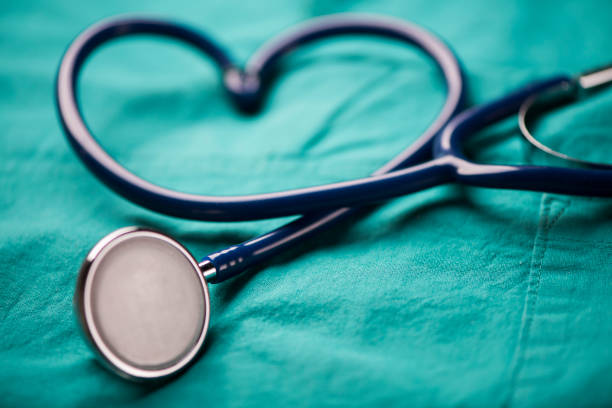 istock A stethoscope shaping a heart on a medical uniform, closeup 908005676