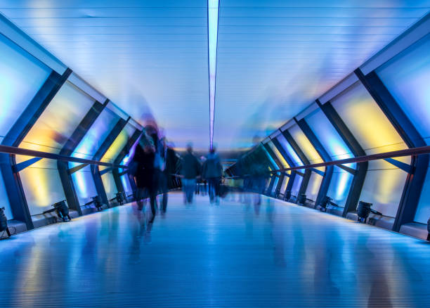 Crossrail with people in blurred motion, Canary Wharf, London, UK Crossrail at night with people in motion, Canary Wharf, London, UK canary wharf photos stock pictures, royalty-free photos & images