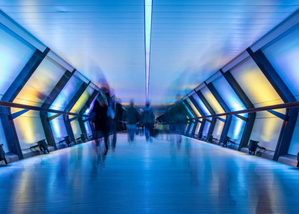 crossrail with people in blurred motion, canary wharf, london, uk - canary wharf imagens e fotografias de stock