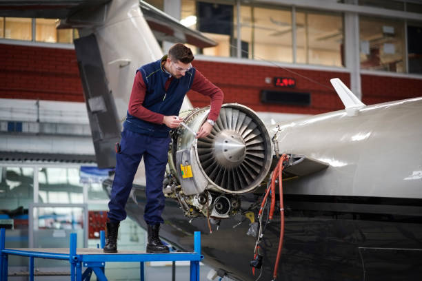 istock Aircraft mechanic in the hangar 908007758