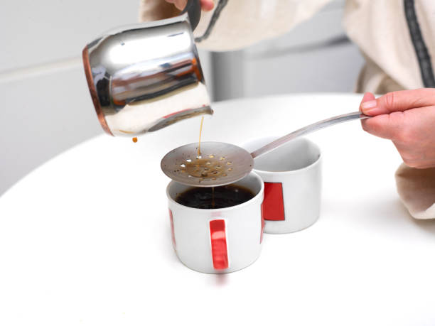 istock Woman Pouring Coffee 908008120