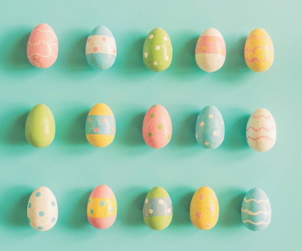 istock Colorful easter eggs on pastel color background with space. 908008154