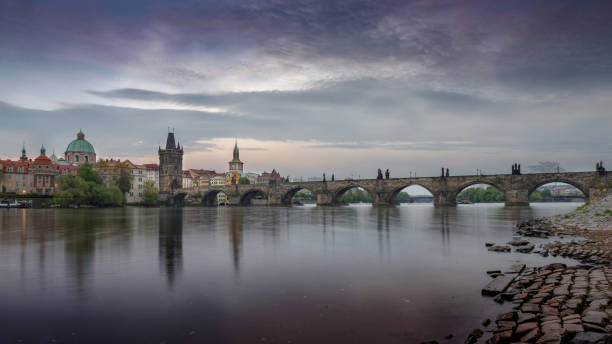 istock Long exposure of Vltava river with Charles Bridge 908008772