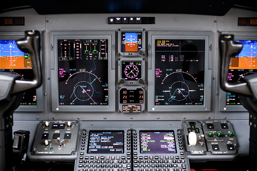 Close up view of airplane dashboard inside the cockpit.