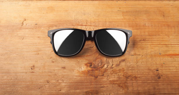 istock fashion sunglasses on a wooden table. 908011206