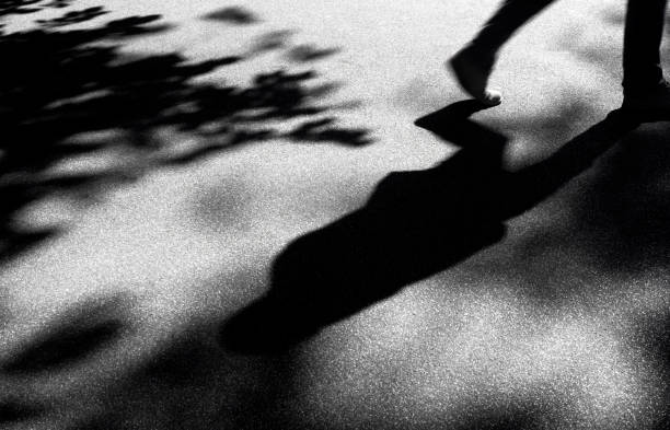 istock Blurry shadow silhouette of a man walking 908011678