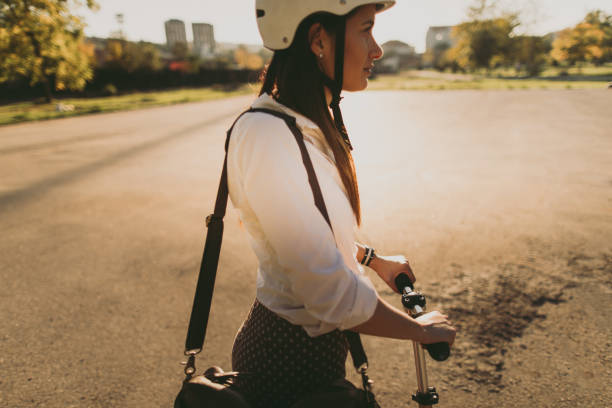 istock Businesswoman on a push scooter 908011976