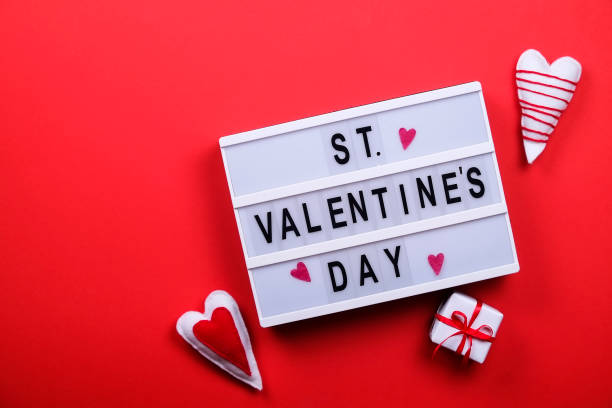 istock Happy valentines day / love symbols concept on bright red background 908018356
