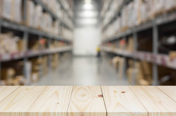 istock wood shelf on blurred  warehouse background 908019436