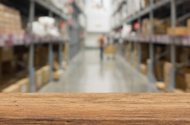 istock wood shelf on blurred  warehouse background 908019466