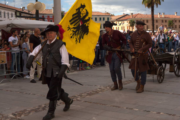 PALMANOVA, ITALY - SEPTEMBER, 03: Parade of historical groups dressed in ancient clothes during the historical Reenactment a.d. 1615 on September 03, 2017