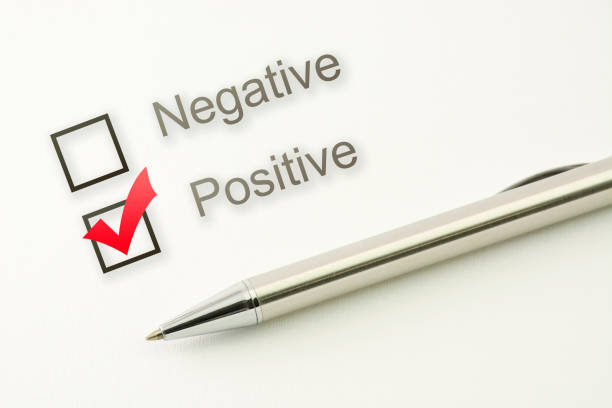 istock questionnaire: positive choice or negative, marked check box with a pen on paper background. Approval concept 908023850