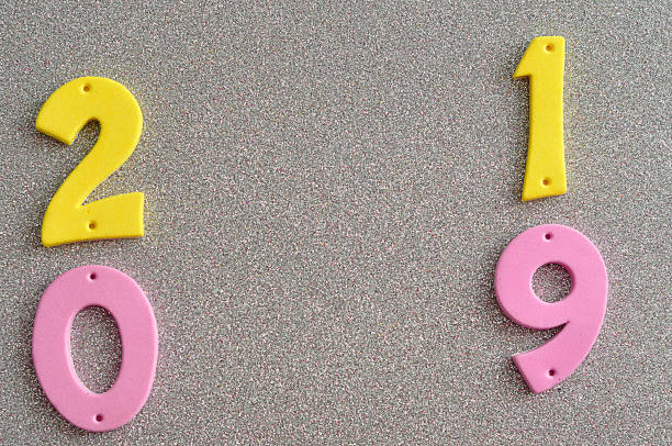 istock 2019 in pink and yellow numbers on a silver background 908027652