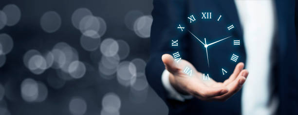 istock IreriBusinessman hand holding clock 908028230