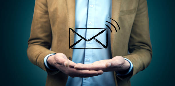istock Businessman hand  email icon on a virtual screen 908028262