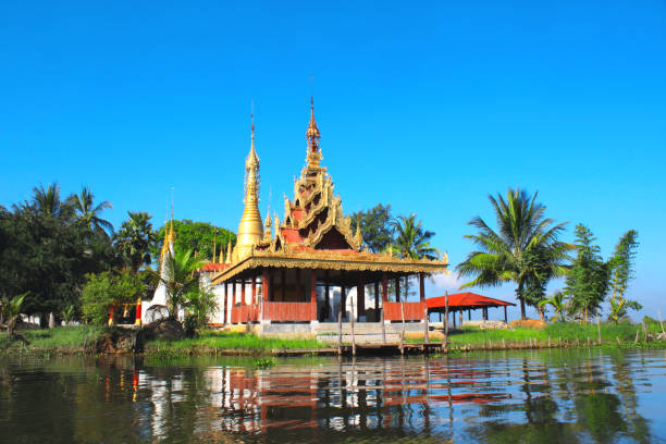 istock Biggest monastery and golden stupa on Inle Lake, Myanmar 908030692